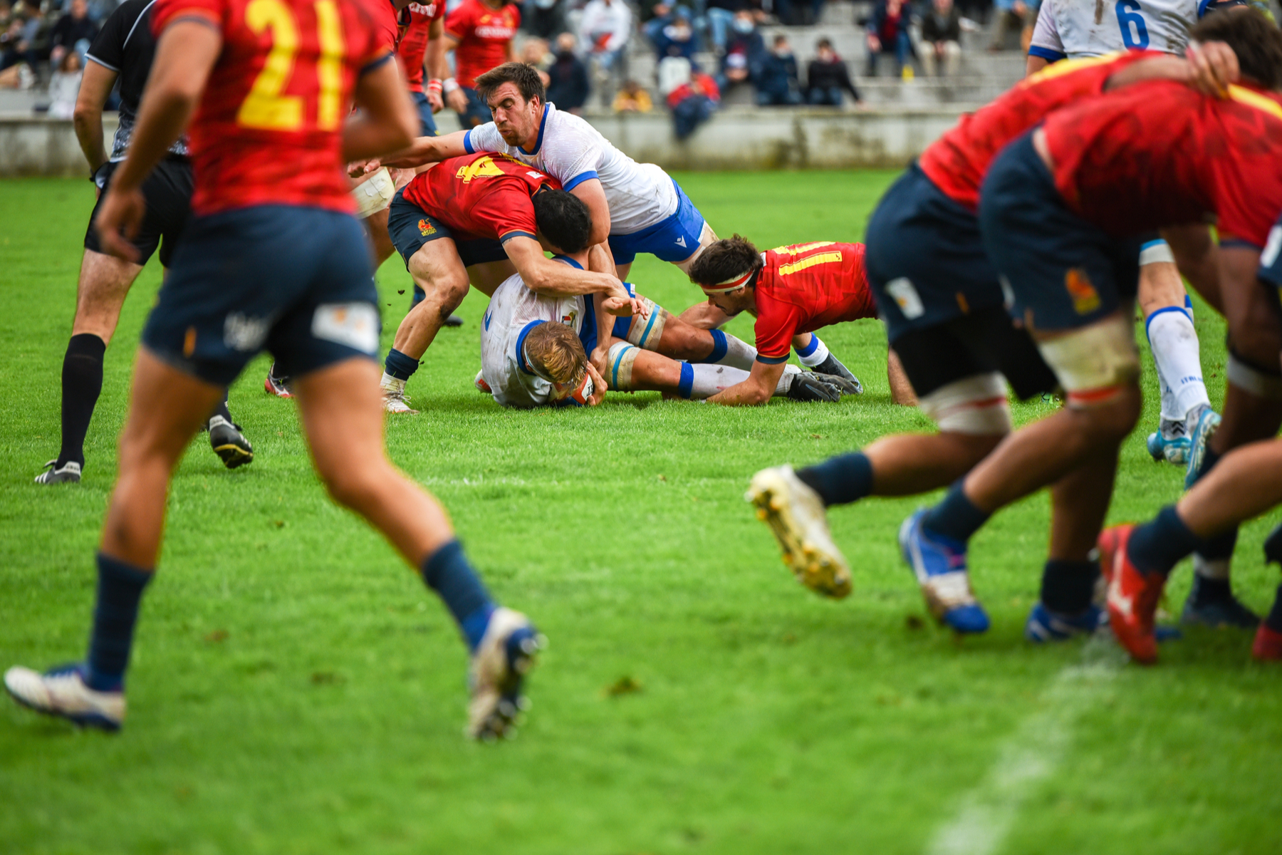 players battle over a ruck in a rugby match