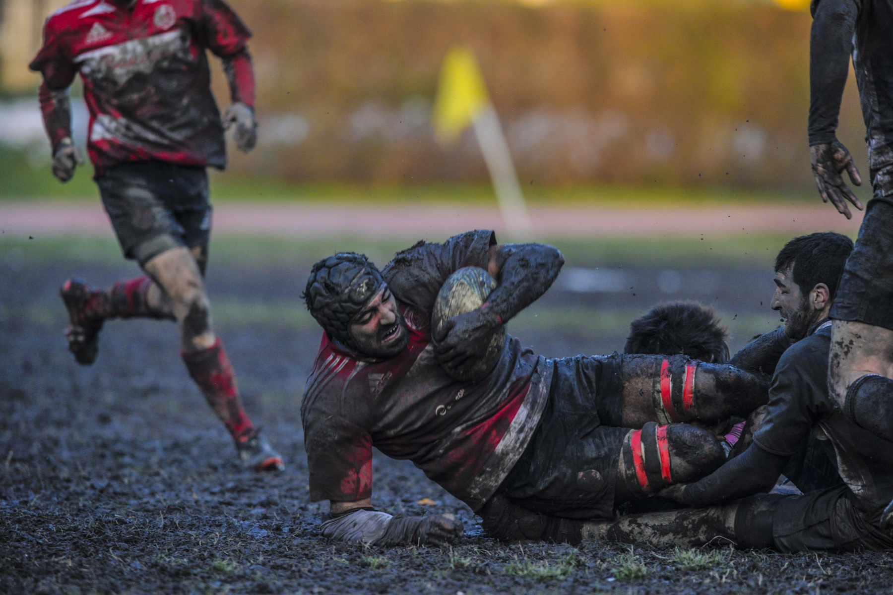 rugby being played in muddy conditions